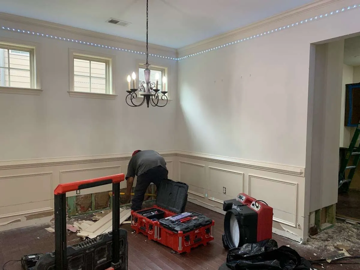 Restoration technician with professional equipment in Robbinsville